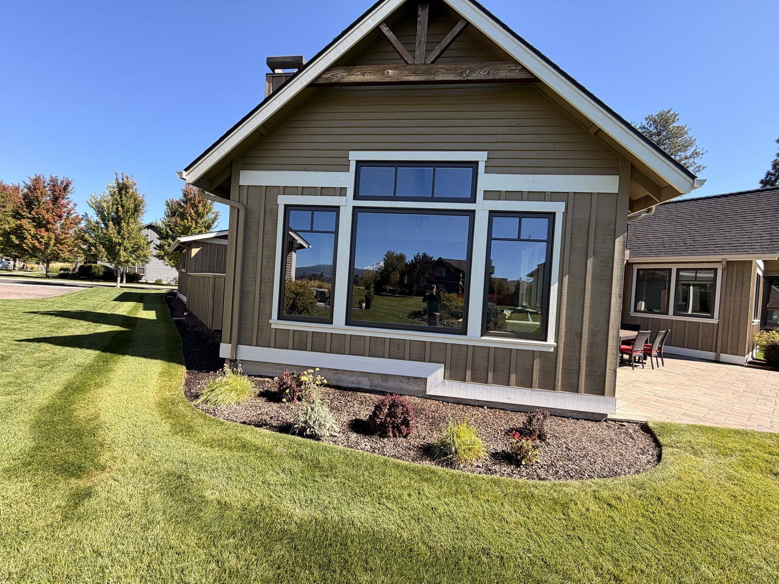 Freshly cleaned windows reflecting the Central Oregon mountains, streak-free